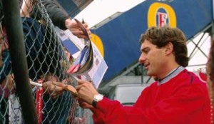 Ayrton Senna signs autographs